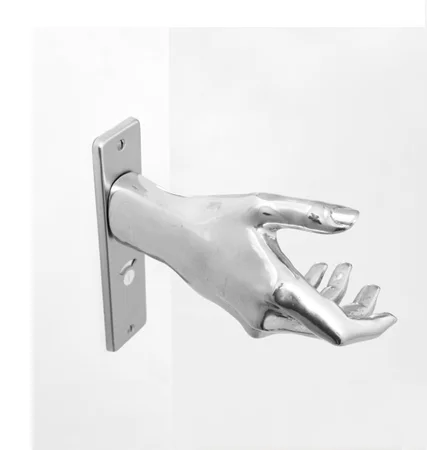 savvyhousekeeping door knob shaped like a hand hand-le